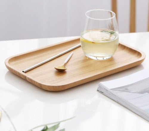 Bamboo tea and food dessert tray with handles, used for serving drinks or snacks, featuring a natural and eco-friendly design.