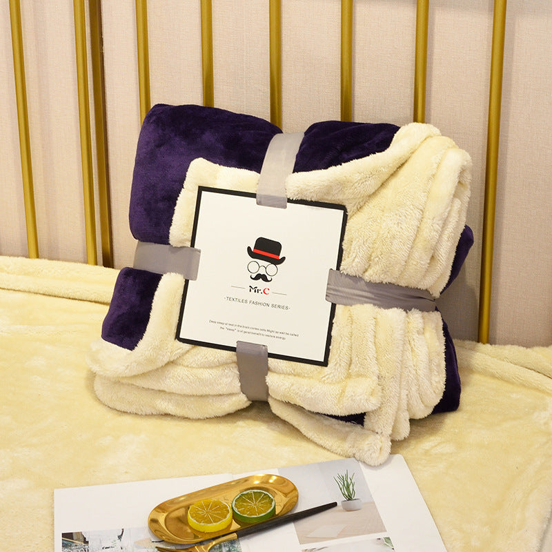 Soft flannel fleece blanket draped over a sofa and bed, providing warmth and cozy comfort for home use