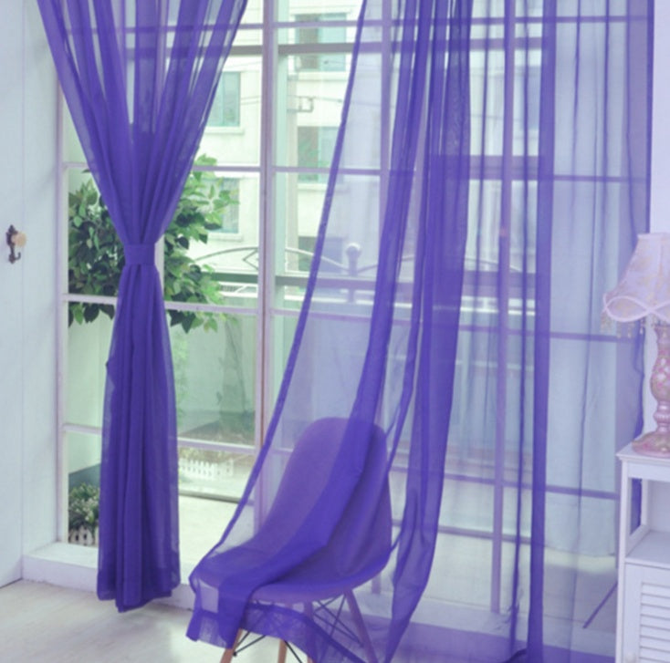 Modern tulle sheer curtains hanging in a bright living room and bedroom, allowing natural light to filter through softly