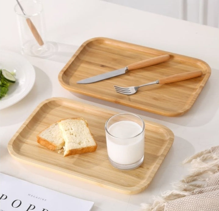 Bamboo tea and food dessert tray with handles, used for serving drinks or snacks, featuring a natural and eco-friendly design.