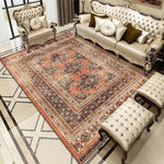 Bohemian Rug - Rectangle Area in retro orange and brown tones, placed in a vintage-style living room with tufted furniture and marble flooring.