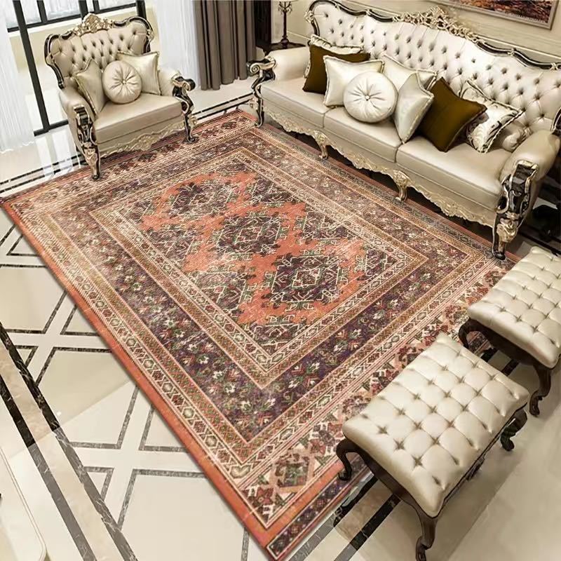 Bohemian Rug - Rectangle Area in retro orange and brown tones, placed in a vintage-style living room with tufted furniture and marble flooring.