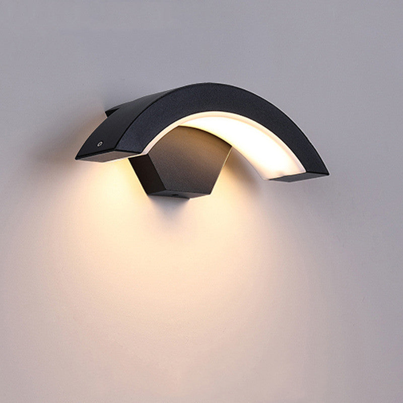 Wall-mounted Curved Moon LED Light emitting warm glow, dimmable and motion-activated, ideal for hallways and entrances.