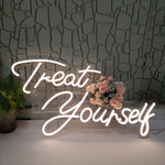 Treat Yourself LED Neon Sign in white script, matching the Oh Baby LED Neon Sign - Birthday Light Decor for self-care or celebration themes.