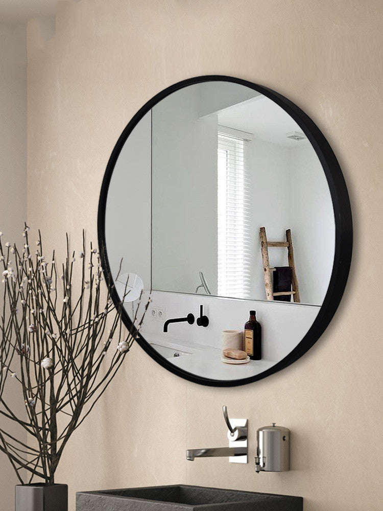 Curve Culture aluminum bathroom vanity mirror mounted above a sink, featuring a sleek black frame and high-definition silver reflection.
