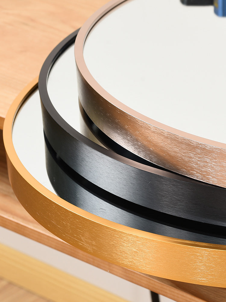 Close-up of Curve Culture vanity mirrors in black, gold, and rose gold aluminum frames, showcasing premium finish and craftsmanship.