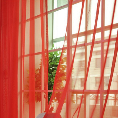 Modern tulle sheer curtains hanging in a bright living room and bedroom, allowing natural light to filter through softly