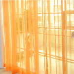 Modern tulle sheer curtains hanging in a bright living room and bedroom, allowing natural light to filter through softly
