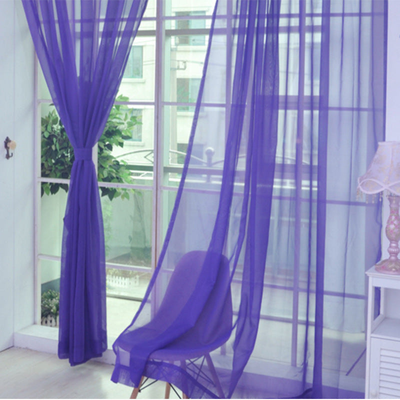 Modern tulle sheer curtains hanging in a bright living room and bedroom, allowing natural light to filter through softly