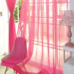 Modern tulle sheer curtains hanging in a bright living room and bedroom, allowing natural light to filter through softly