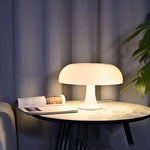 White Decorative Mushroom Lamp on a round table, offering soft ambient lighting for bedroom or living room with 3-color dimming.