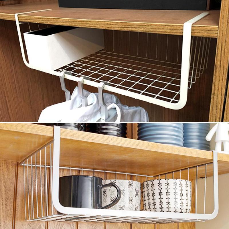 Wrought iron storage basket used for home organization, holding household items neatly on a shelf or countertop