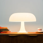 White Decorative Mushroom Lamp on a wooden console, ideal for stylish bedroom or living room lighting with USB 3-color options.