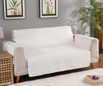 Durable sofa couch cover neatly fitted over a couch, protecting the furniture and giving it a fresh, clean look