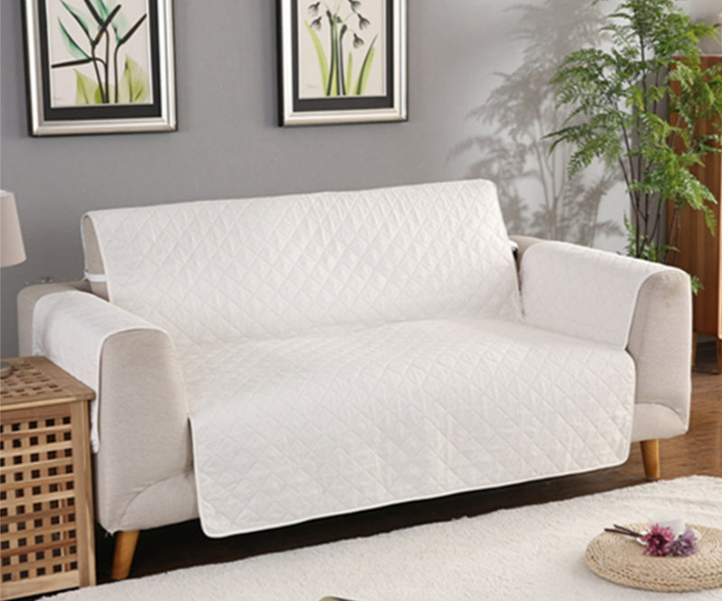 Durable sofa couch cover neatly fitted over a couch, protecting the furniture and giving it a fresh, clean look