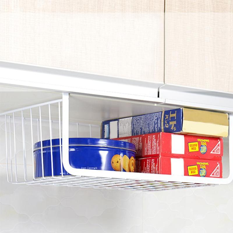 Wrought iron storage basket used for home organization, holding household items neatly on a shelf or countertop