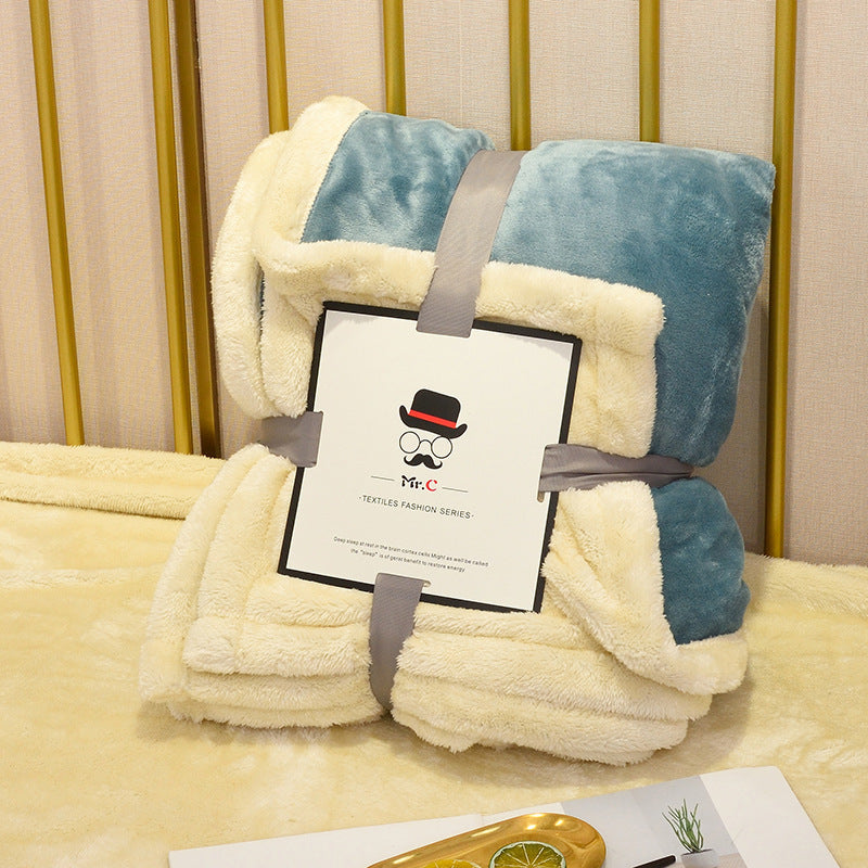 Soft flannel fleece blanket draped over a sofa and bed, providing warmth and cozy comfort for home use
