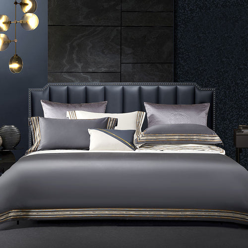 Elegant 4-piece embroidered bedding set with 140 thread count, displayed on a neatly made bed for a luxurious bedroom look