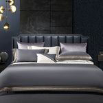 Elegant 4-piece embroidered bedding set with 140 thread count, displayed on a neatly made bed for a luxurious bedroom look