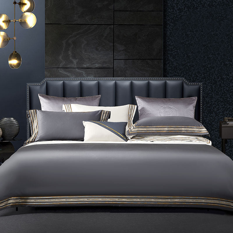 Elegant 4-piece embroidered bedding set with 140 thread count, displayed on a neatly made bed for a luxurious bedroom look