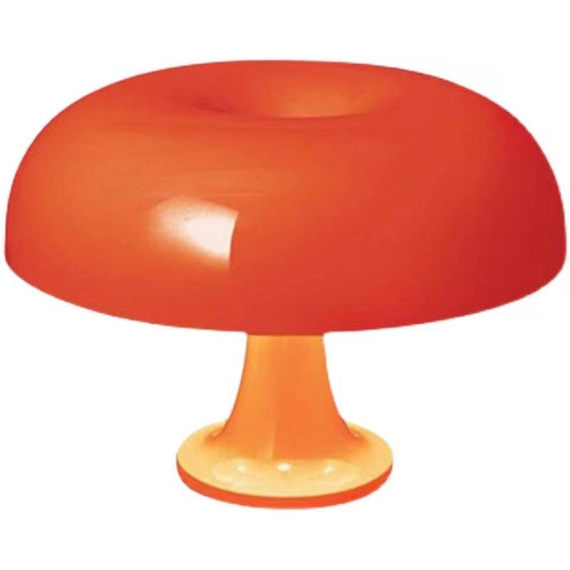 Close-up of orange Decorative Mushroom Lamp with acrylic base, perfect for modern bedroom or living room decor with dimmable light.