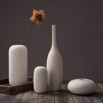 Scandinavian ceramic vase with a minimalist design, perfect for modern home decor and displaying fresh or dried flowers.