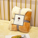 Soft flannel fleece blanket draped over a sofa and bed, providing warmth and cozy comfort for home use