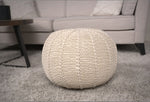 Cotton Pouf Ottoman - Knitted Beige Pouf styled in a cozy living room setting, used as a decorative floor cushion or ottoman.