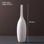 Scandinavian ceramic vase with a minimalist design, perfect for modern home decor and displaying fresh or dried flowers.