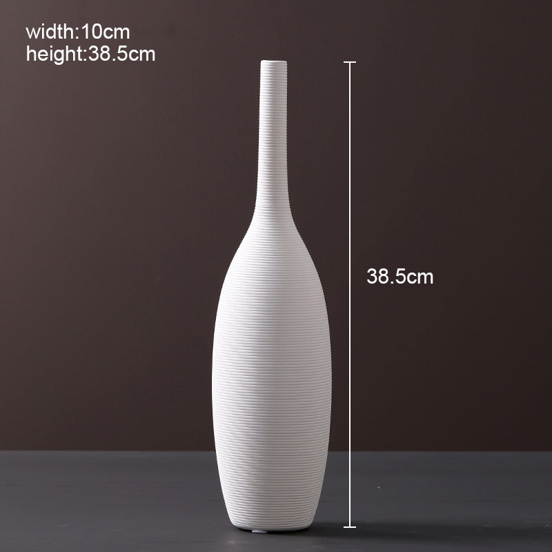 Scandinavian ceramic vase with a minimalist design, perfect for modern home decor and displaying fresh or dried flowers.