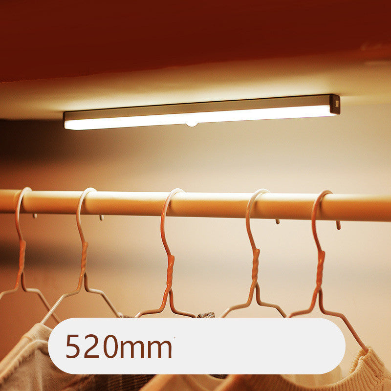 USB rechargeable LED sensor light bar mounted under a cabinet, emitting bright white light with a sleek modern design