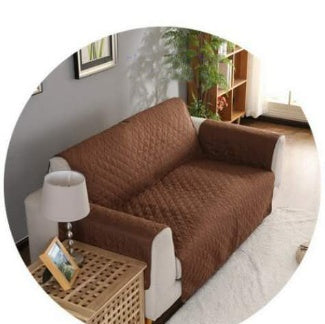 Durable sofa couch cover neatly fitted over a couch, protecting the furniture and giving it a fresh, clean lookDurable sofa couch cover neatly fitted over a couch, protecting the furniture and giving it a fresh, clean look