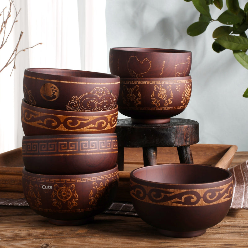 Ethnic wooden bowl with intricate carved patterns, showcasing traditional craftsmanship and rustic decorative style
