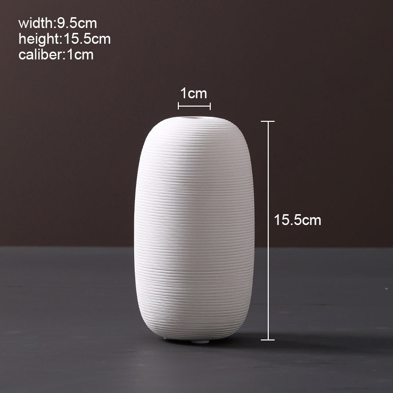 Scandinavian ceramic vase with a minimalist design, perfect for modern home decor and displaying fresh or dried flowers.