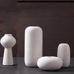 Scandinavian ceramic vase with a minimalist design, perfect for modern home decor and displaying fresh or dried flowers.