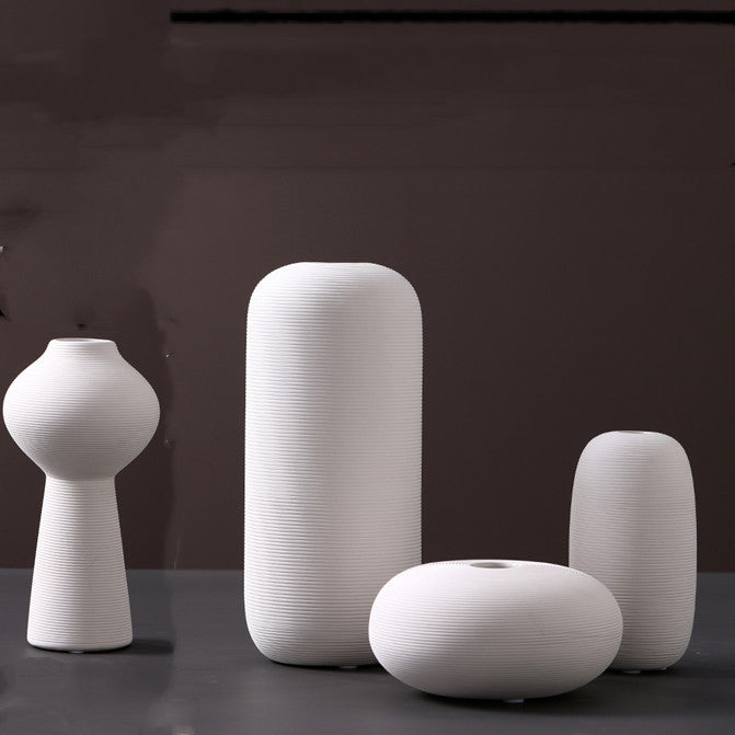 Scandinavian ceramic vase with a minimalist design, perfect for modern home decor and displaying fresh or dried flowers.