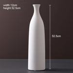 Scandinavian ceramic vase with a minimalist design, perfect for modern home decor and displaying fresh or dried flowers.