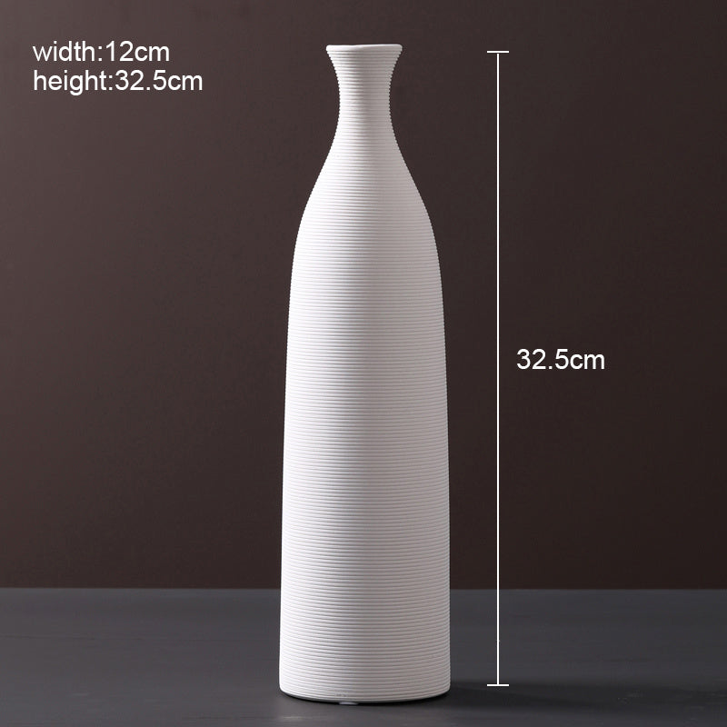 Scandinavian ceramic vase with a minimalist design, perfect for modern home decor and displaying fresh or dried flowers.