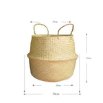 Portable seagrass woven flower storage basket with handles, used for organizing items or displaying plants in natural home decor style