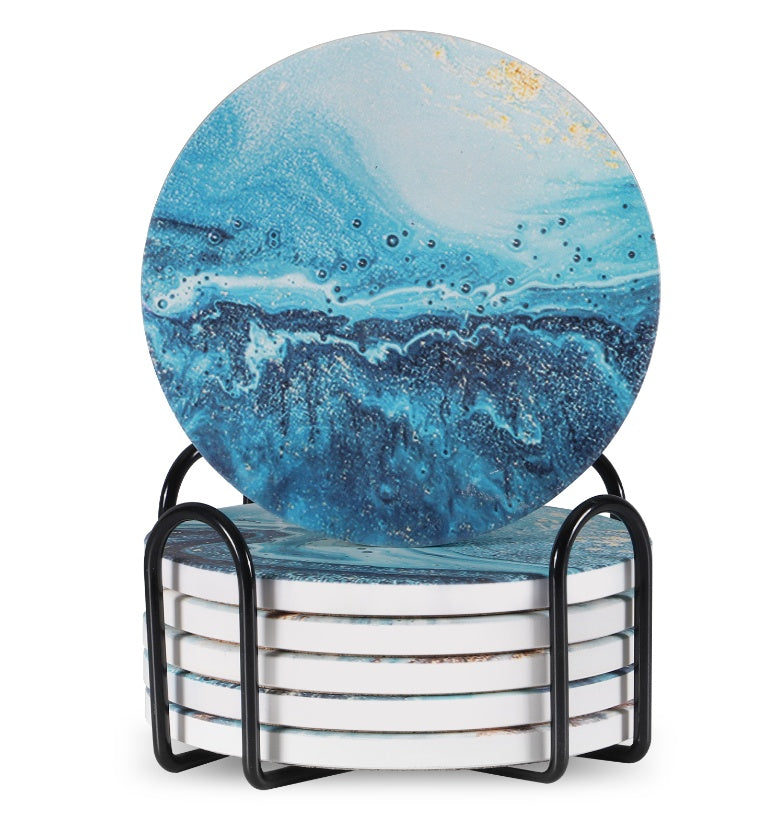 Set of 6 ceramic beverage coasters with an elegant holder stand, designed to protect tabletops and add a stylish touch to home decor.