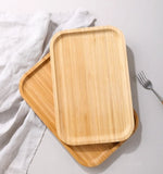 Bamboo tea and food dessert tray with handles, used for serving drinks or snacks, featuring a natural and eco-friendly design.