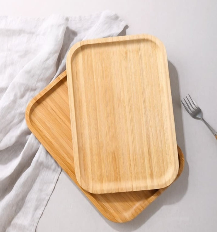 Bamboo tea and food dessert tray with handles, used for serving drinks or snacks, featuring a natural and eco-friendly design.