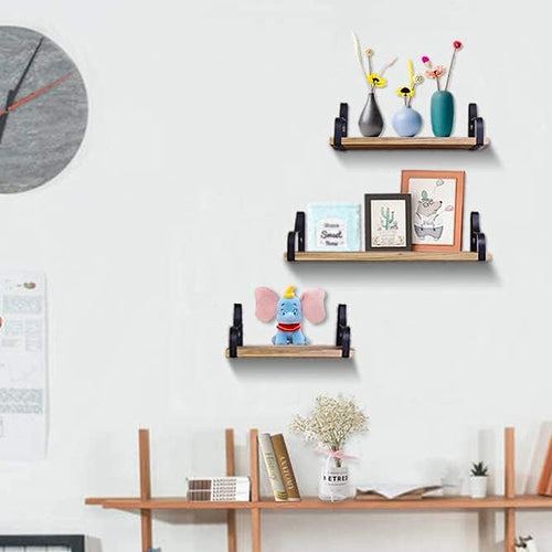 3 Pcs Wood Floating Shelves - Wooden Floating Shelves mounted on a white wall, displaying vases, toys, and framed art in a modern home office.