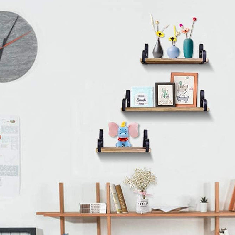 3 Pcs Wood Floating Shelves - Wooden Floating Shelves mounted on a white wall, displaying vases, toys, and framed art in a modern home office.