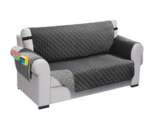 Durable sofa couch cover neatly fitted over a couch, protecting the furniture and giving it a fresh, clean look