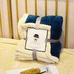 Soft flannel fleece blanket draped over a sofa and bed, providing warmth and cozy comfort for home use
