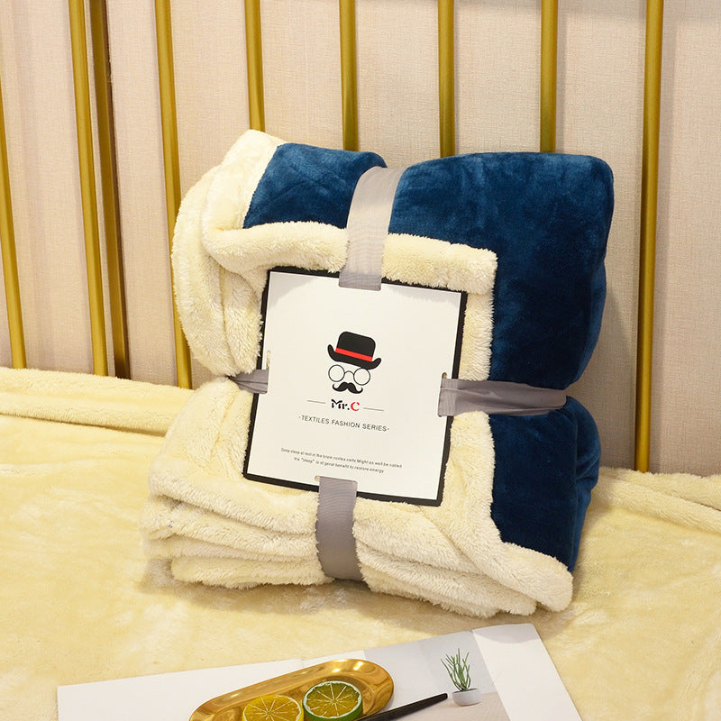 Soft flannel fleece blanket draped over a sofa and bed, providing warmth and cozy comfort for home use