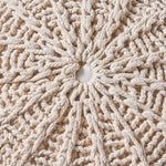 Close-up of the Cotton Pouf Ottoman's knitted beige surface, showcasing the intricate handwoven texture and durable cotton material.