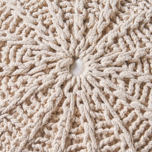 Close-up of the Cotton Pouf Ottoman's knitted beige surface, showcasing the intricate handwoven texture and durable cotton material.