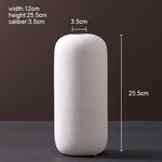 Scandinavian ceramic vase with a minimalist design, perfect for modern home decor and displaying fresh or dried flowers.